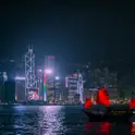 Traditional red-sailed junk boat on Victoria Harbour, Hong Kong