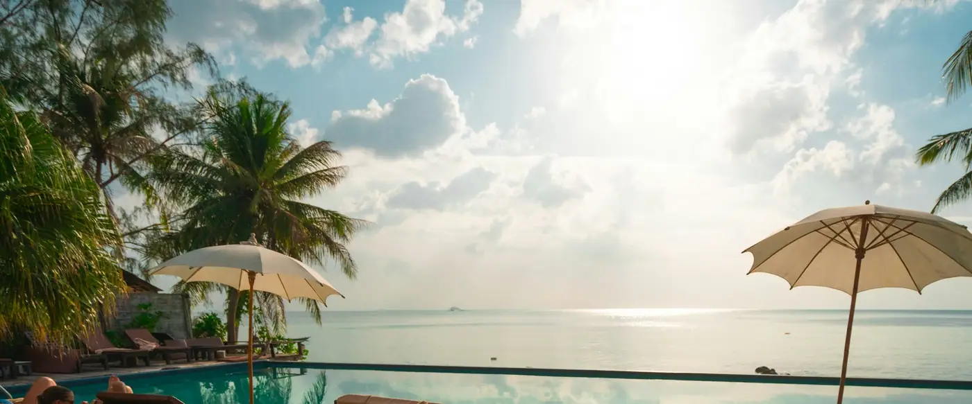Wooden deck loungers over turquoise water