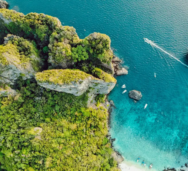 Aerial view of a tropical Thai island and turquoise sea