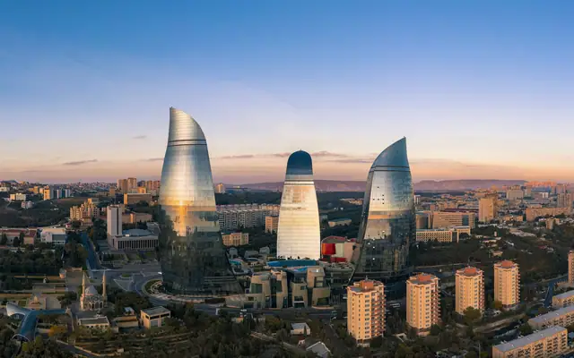 Baku skyline and Flame Towers under a blue sky