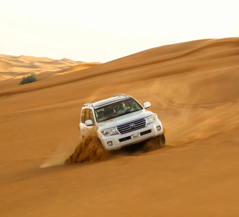 4x4 on golden desert dunes